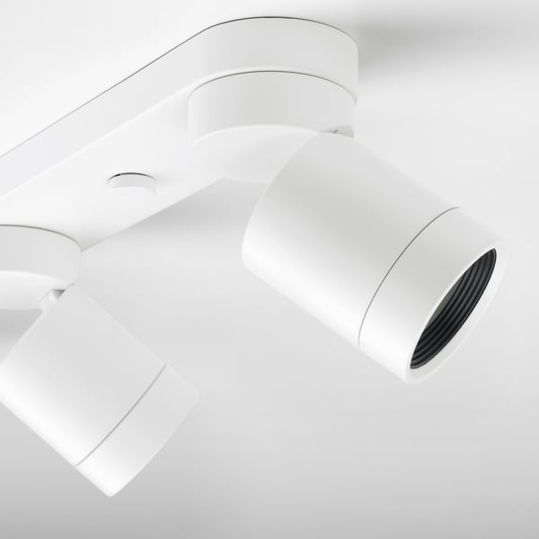 Modern white ceiling spots. Three adjustable lights in sleek design.