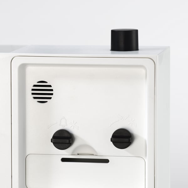 White appliance with 3 knobs, modern design.