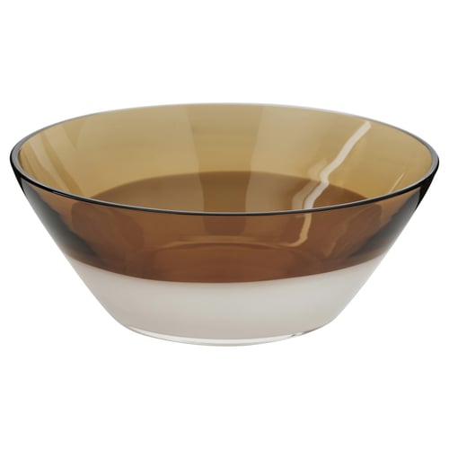 An OMMJÄNGE, a handcrafted glass bowl in amber with a transparent bottom, reflecting modern swedish folk art design.