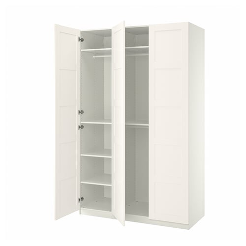 An open white ikea PAX wardrobe with adjustable interiors and soft-closing hinges.