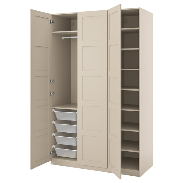 An open beige PAX wardrobe with organiser baskets and shelves.