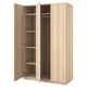 A light brown, wooden PAX wardrobe with two open doors, revealing multiple shelves and a clothes rail inside.