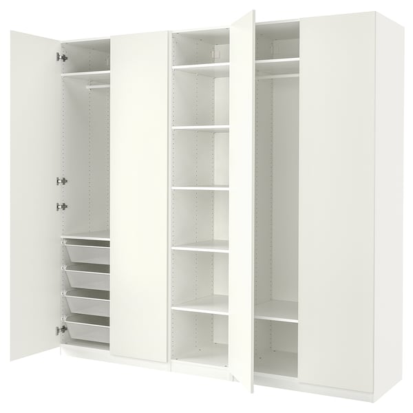 An all-white ikea PAX wardrobe with open doors, displaying multiple shelves and mesh baskets.