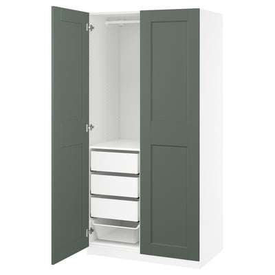 Open green and white wardrobe PAX showcasing shelves and baskets.