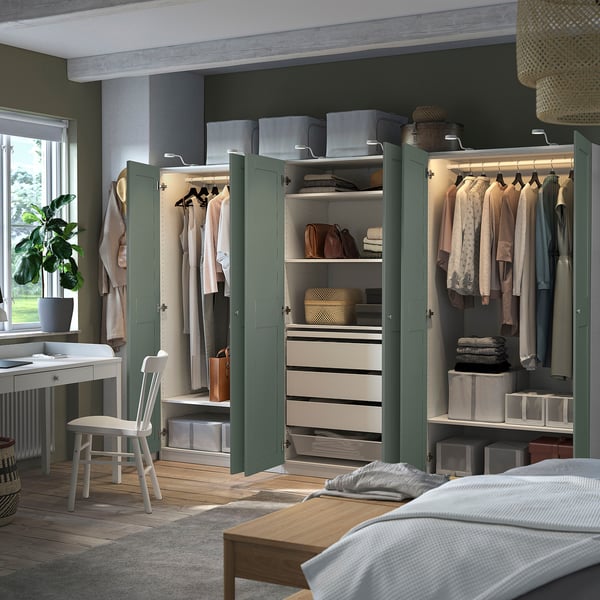 Organised closet with PAX wardrobes, shelves, and lighting.