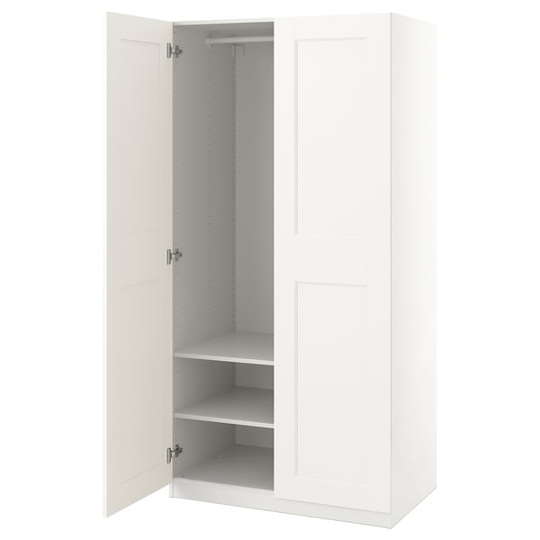 A white ikea PAX wardrobe with one door open, revealing adjustable shelves inside.