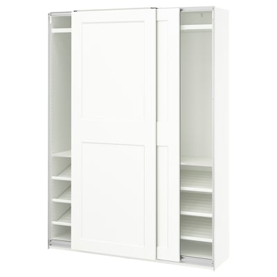 A white PAX wardrobe with sliding doors and internal shelves.