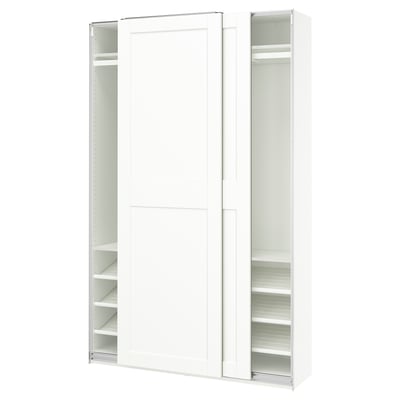 A white PAX wardrobe with sliding doors and adjustable shelves.