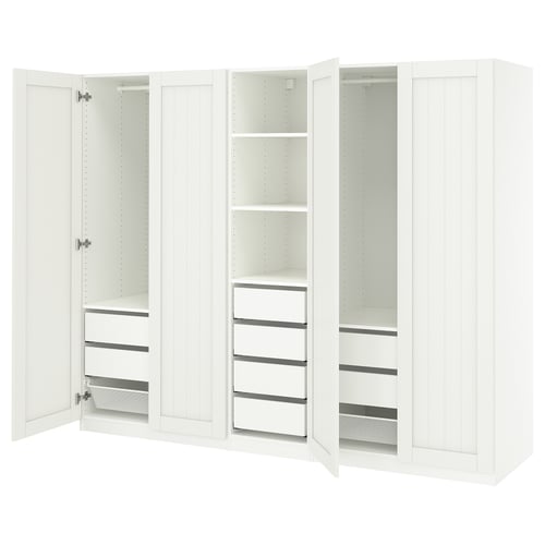 White PAX wardrobe with open doors, shelves, and drawers.