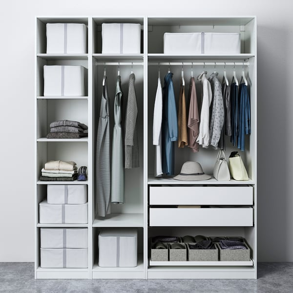 Modern closet with clothes, accessories, and storage boxes, featuring adjustable shelves and hangers.