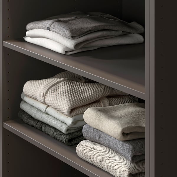Folded towels on shelf in PAX wardrobe.