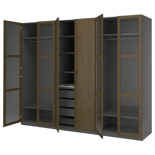 Large dark wood wardrobe with glass doors open, displaying shelves and hangers.