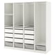 A white ikea PAX wardrobe, featuring open shelves and compartments, with metallic mesh baskets and pull-out trays.