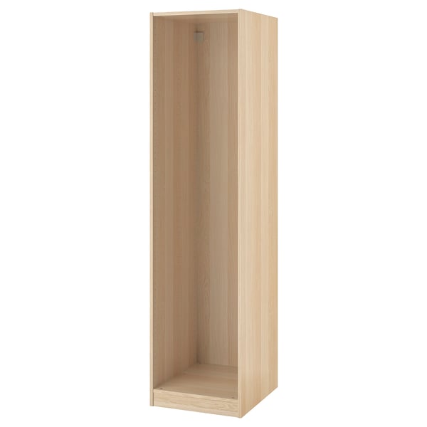 Light-colored ikea PAX wardrobe frame with adjustable feet for custom storage.