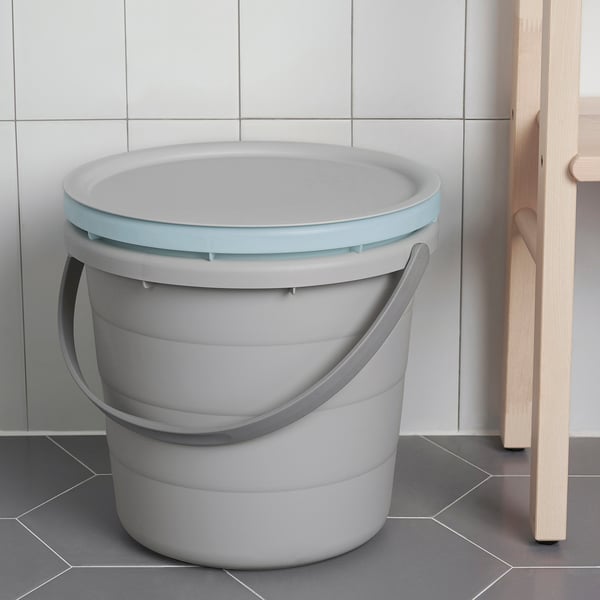 Grey plastic PEPPRIG bucket with light blue lid and handle sits on tiled floor. Suitable for carrying water or storing items with secure lid.
