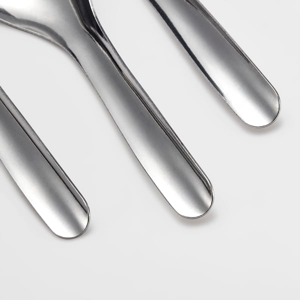Three polished metallic spoons arranged neatly, reflecting light, showcasing high-quality, smooth, and shiny surfaces.