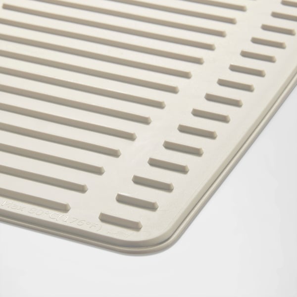 Close-up of a folded RINNIG drying mat showcasing its raised, ridged texture for optimal drainage and non-slip surfaces.