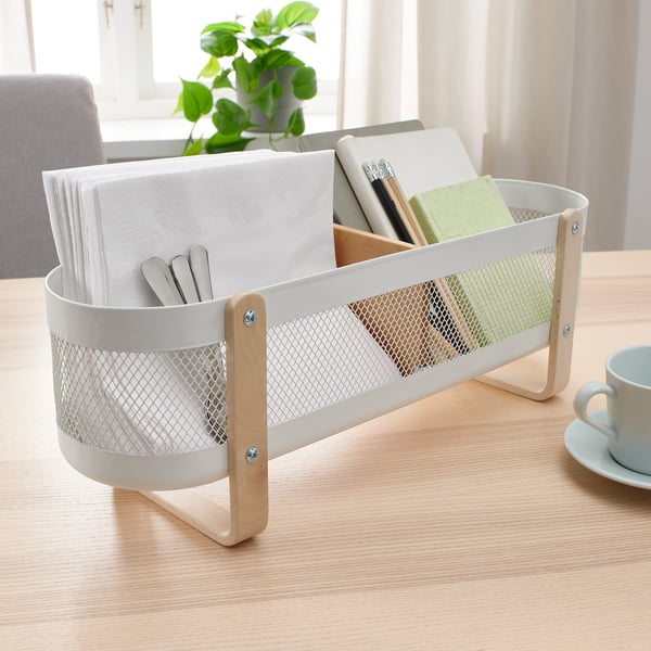 White RISATORP organiser on desk with compartments for files, pens, and cups, suitable for work or study spaces, not for outdoor use.