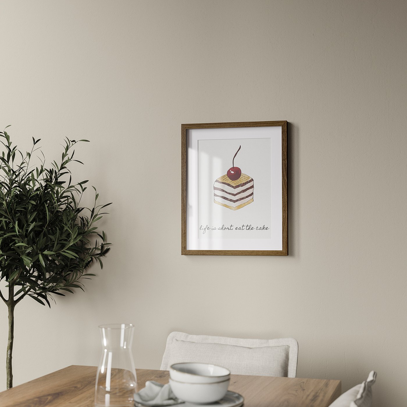 Cosy dining room with cake art, teacup, carafe, and green leaves.
