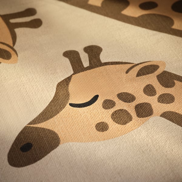 Close-up of flatwoven giraffe rug. Tan background with detailed, patterned giraffe in dark brown. Soft texture, quality cotton.