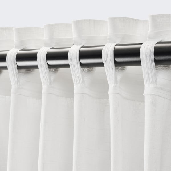 Sheer white curtains with a rod pocket for hanging, designed to philtre light and provide privacy.