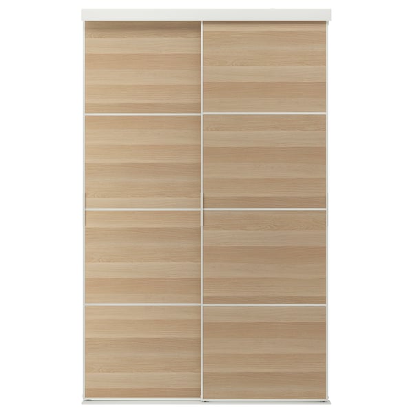 A light wooden SKYTTA sliding closet door with minimalist style.
