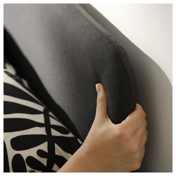 The SLATTUM bed frame in grey padded upholstery and a modern, minimalist design.