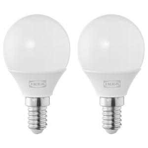 Two round, white led light bulbs by IKEA, made of durable plastic, standing upright on a white background.