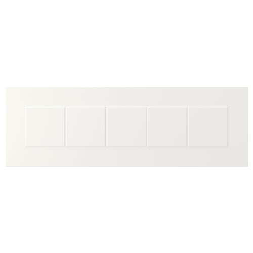 White STENSUND cabinet fronts, featuring framed panels and grooved details, offering a classic, country-style design.