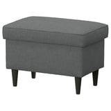 A grey STRANDMON footstool with storage, featuring a rectangular shape, upholstered in recycled polyester, and supported by dark wooden legs.