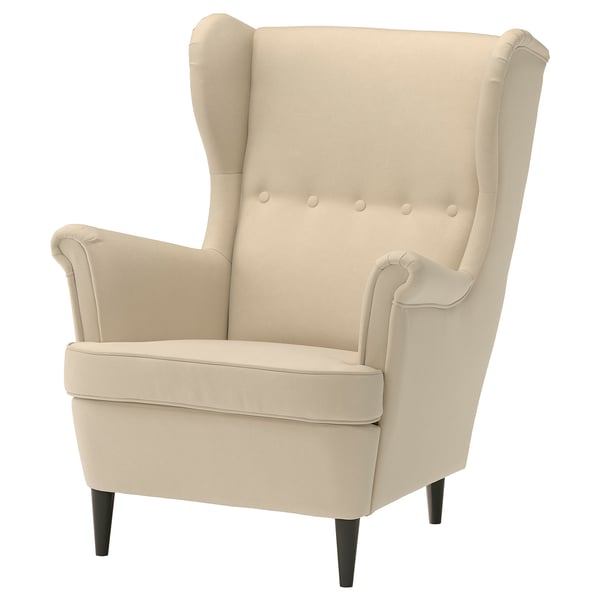 STRANDMON armchair, off-white. Comfortable, high back, button tufted, black wooden legs.