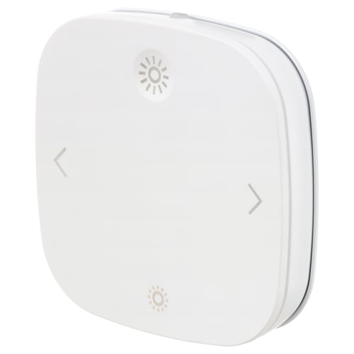 White rectangular remote control with symbols for sun and arrows for adjusting light. Made of abs plastic.