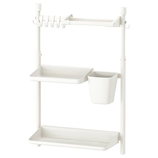 White SUNNERSTA wall shelf, metal, rectangular, three-tiered with hooks and hanging bucket.