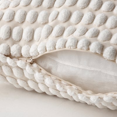 White textured cushion with a zip for easy cover removal. Soft, recycled polyester.