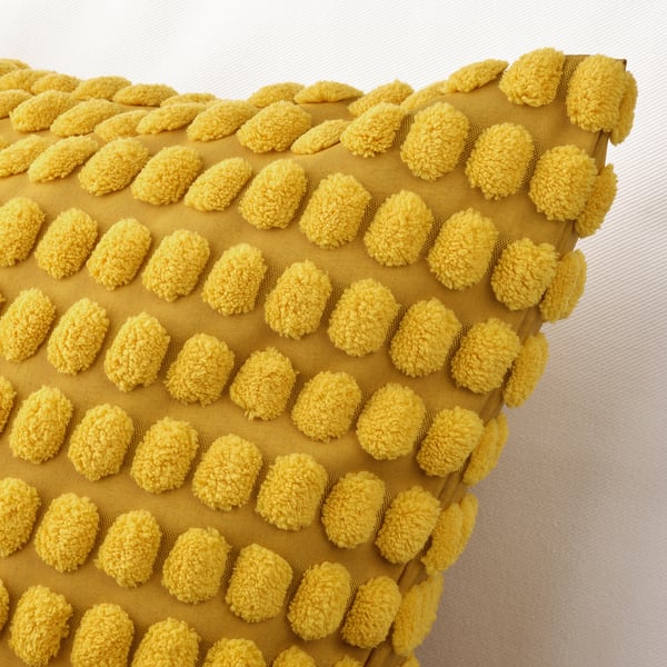 Textured yellow throw pillow with soft, fuzzy pattern; recycled materials; zip closure.
