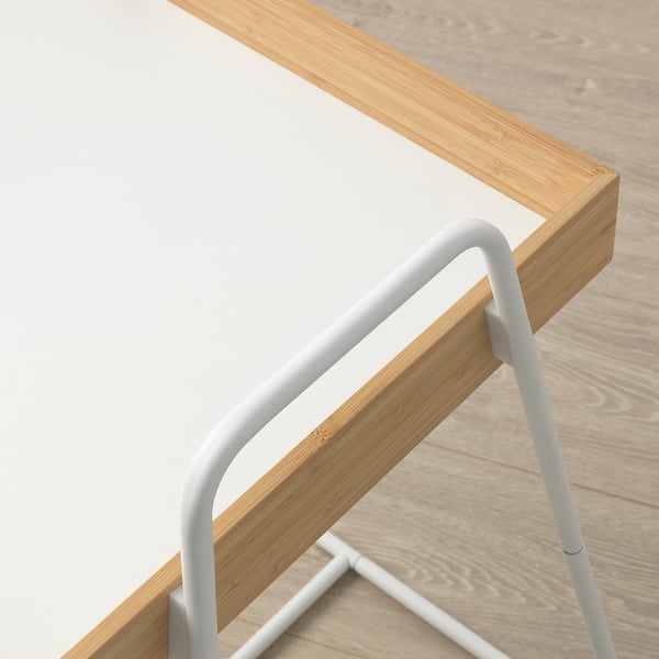 Minimalist side table with light wood top and sleek metal legs. High edges prevent items from sliding off.
