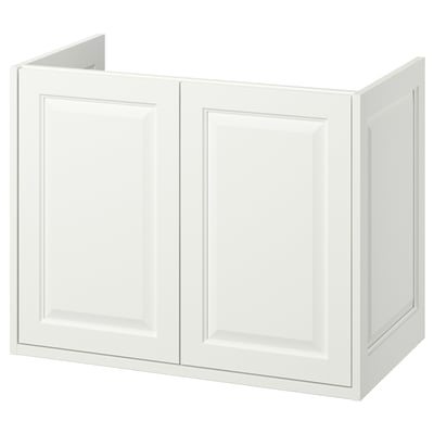 A white TÄNNFORSEN bathroom cabinet with bevelled panels, two doors, and a classic design.