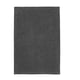 A dark grey TOFTBO bath mat. Its rectangular, soft, and textured, made from recycled polyester.