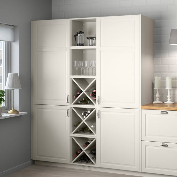 Grey kitchen cabinet with wine bottles and glasses.