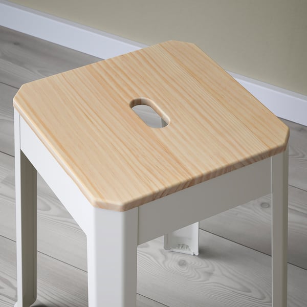 A stylish, sturdy stool with a wooden seat and metal legs, perfect for extra seating.