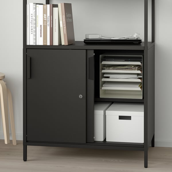 Black storage cabinet with open shelves, closed doors, and organiser trays, divided for versatile use and organisation.