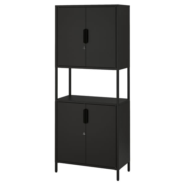A black TROTTEN storage cabinet with two doors, made of metal. It has a rectangular shape with adjustable feet.