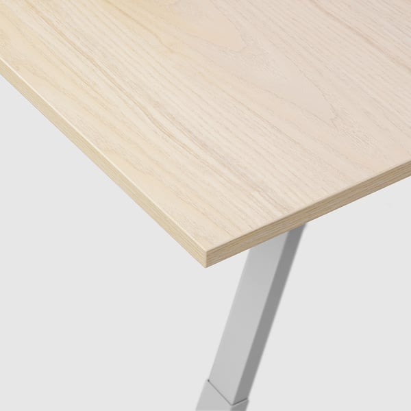 Modern desk with light wood top and metal legs. Strong, clean design.