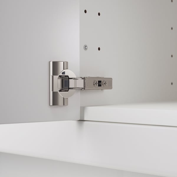 Silver kitchen cabinet hinge with adjustable settings and integrated soft-close mechanism.