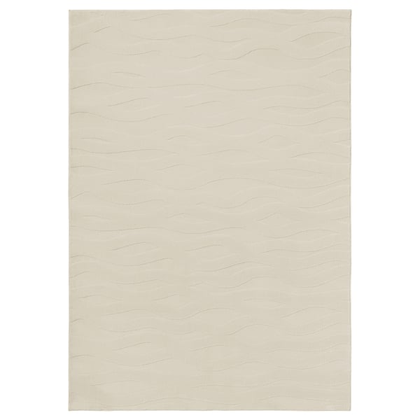 Displays a VÄXELFEL rug in beige, featuring a soft, wavy 3d pattern and recycled polyester material.