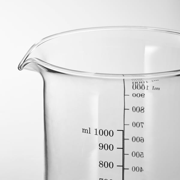 Clear glass measuring jug with black markings up to 1000 ml, showcasing quality and precision.