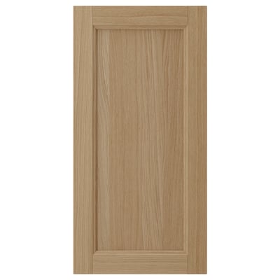 VEDHAMN oak kitchen cabinet door, natural wood, rectangular shape, solid oak frame with veneer panel, warm tone.