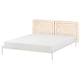 The VEVELSTAD bed a white metal frame with a rattan headboard, offering a modern and cosy design.
