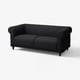 VISKAFORS black sofa. Classic design, soft rounded shapes, deep cushions. Dark fabric, wooden legs.