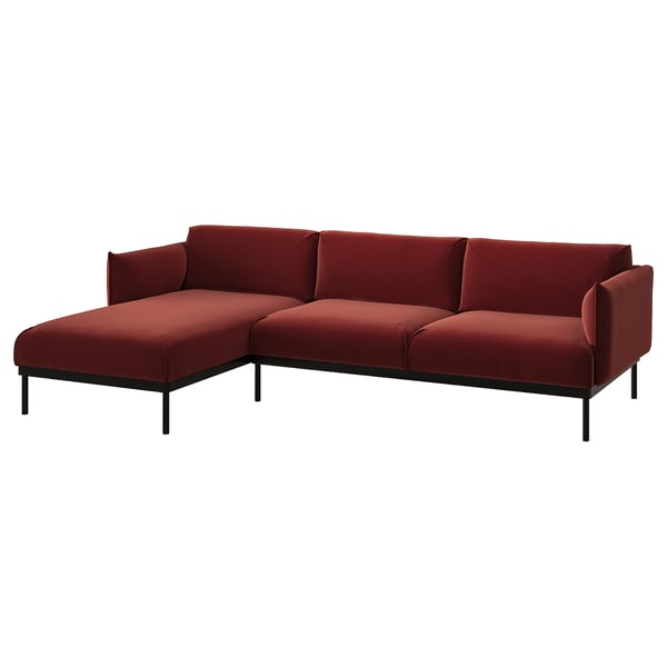 Modern red l-shaped sofa with sleek metal legs, deep cushions, and minimalist design.